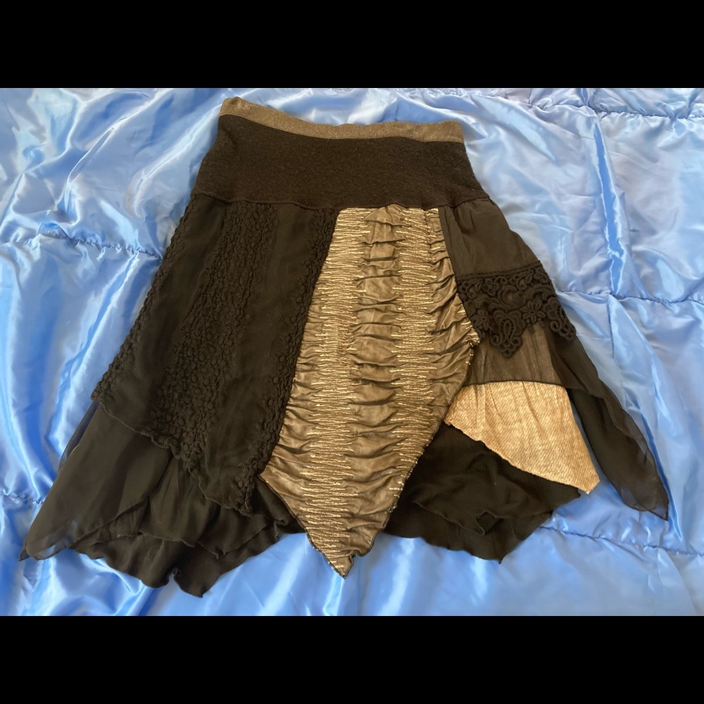 Elisa Cavaletti multi layer and multi fabric skirt.